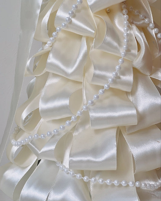Another view of the White Satin dried Christmas tree with satin ribbon and pearl strings