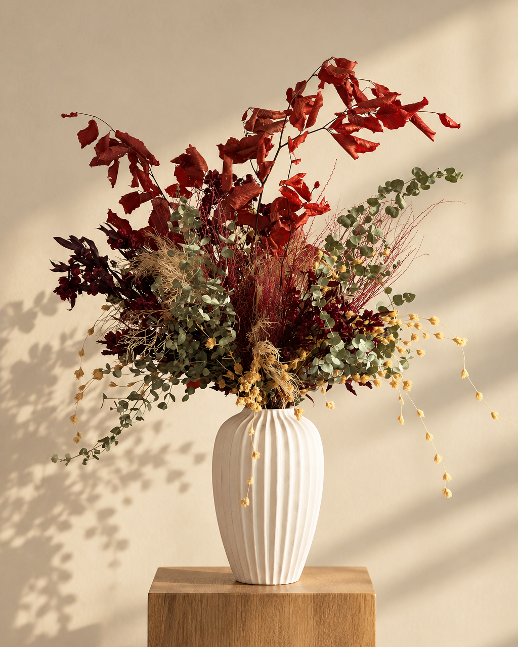 Autumn preserved centrepiece on a timber plinth in warm afternoon light, Singapore