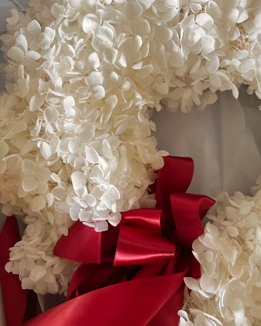 Snow-white preserved hydrangea Christmas wreath with satin bows, indoor decor in Singapore