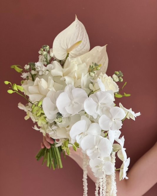 Hand-tied ivory and white cascading bridal bouquet for intimate ceremony — Singapore florist
